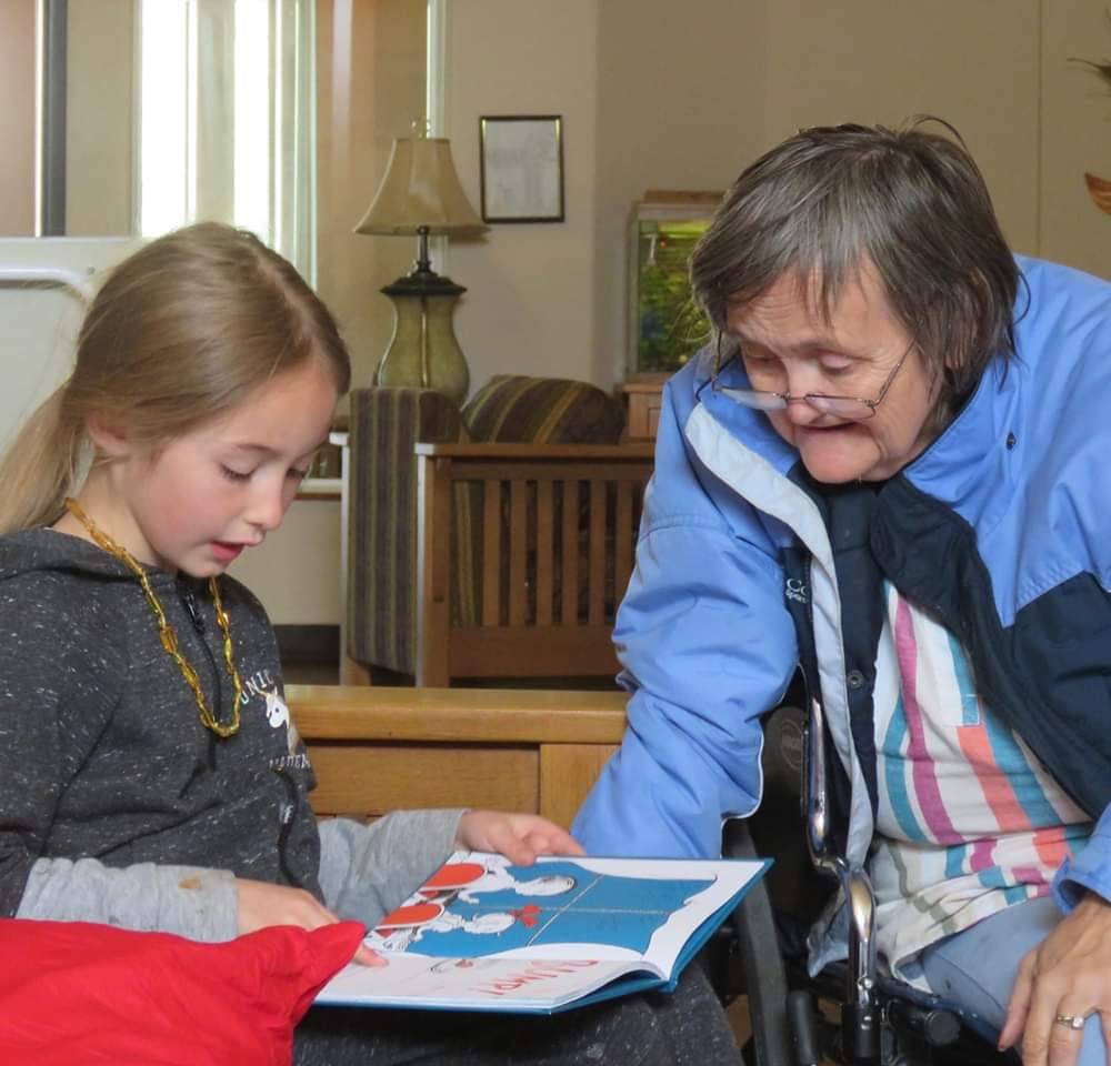 Young lady visitor with old lady